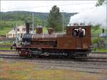 Vapeur Val-de-Travers: Train  Au fil de l'Areuse .

E 3/3 8511 umfhrt in Travers ihren Zug. Mai 2023.