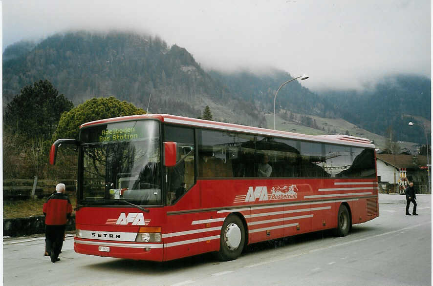 (066'014) - AFA Adelboden - Nr. 12/BE 26'702 - Setra am 14. Mrz 2004 beim Bahnhof Frutigen