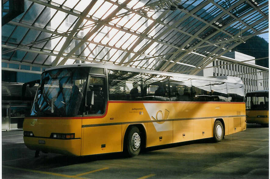 (066'735) - AutoPostale Ticino-Moesano - TI 215'311 - Neoplan (ex P 25'127) am 20. April 2004 in Chur, Postautostation