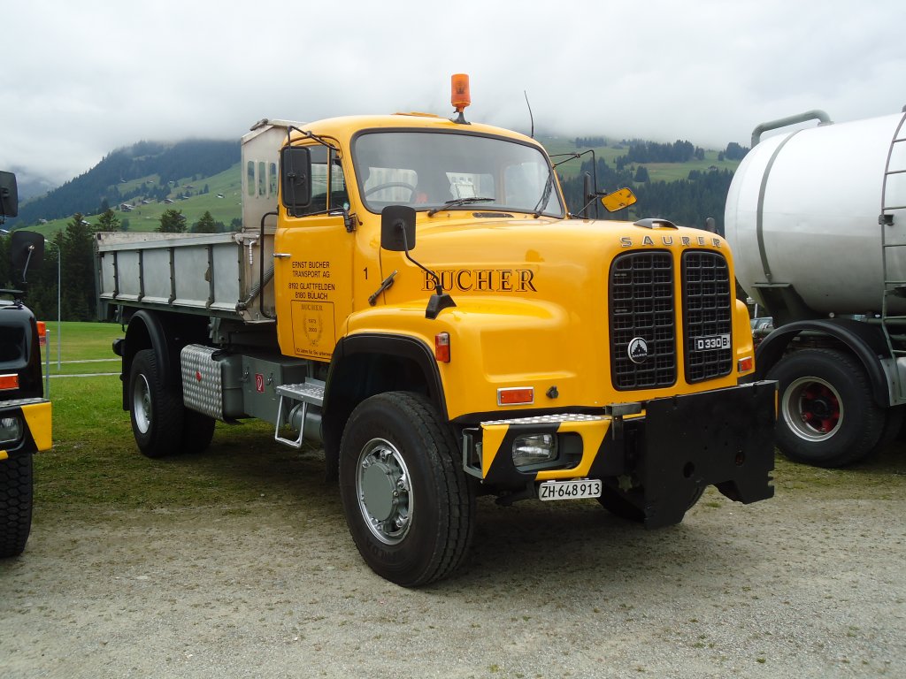 (129'978) - Bucher, Glattfelden - Nr. 1/ZH 648'013 - Saurer am 18. September 2010 in Breil, Militranlage