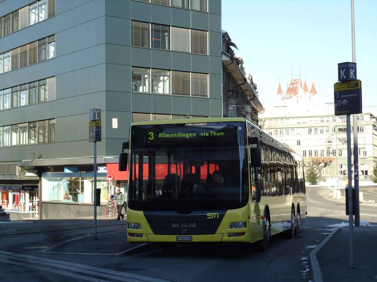 (142'504) - STI Thun - Nr. 148/BE 801'148 - MAN am 12. Dezember 2012 beim Bahnhof Thun