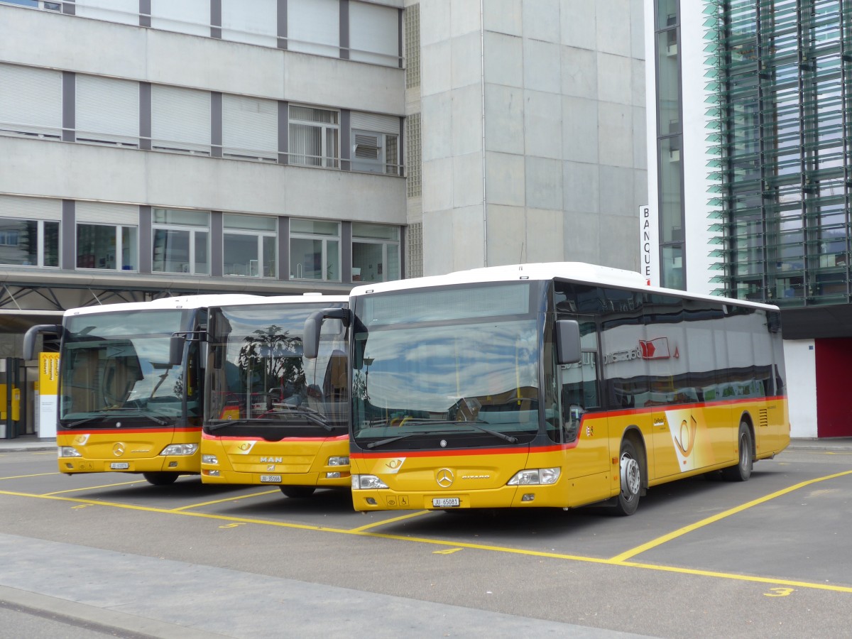 (151'061) - CarPostal Ouest - Nr. 14/JU 65'081 - Mercedes am 29. Mai 2014 in Delmont, Place de la Poste