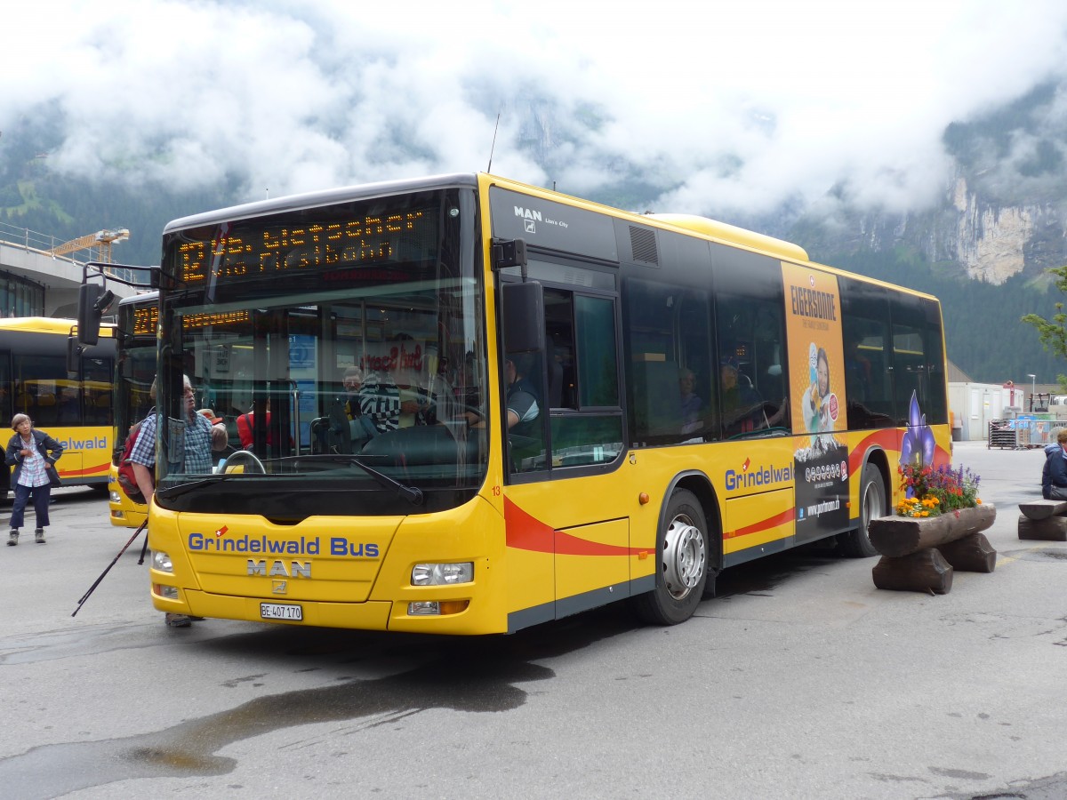 (153'550) - AVG Grindelwald - Nr. 13/BE 407'170 - MAN/Gppel am 3. August 2014 beim Bahnhof Grindelwald