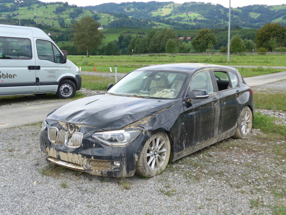 (153'884) - BMW am 16. August 2014 nach dem Unwetter in Altsttten, Allmendplatz