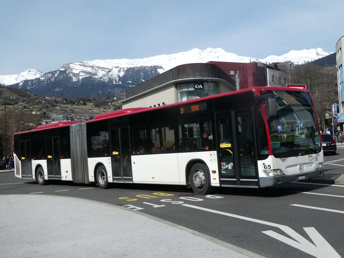 (247'257) - PostAuto Wallis - Nr. 65/VS 186'400/PID 5315 - Mercedes (ex Lathion, Sion Nr. 65) am 16. Mrz 2023 beim Bahnhof Sion