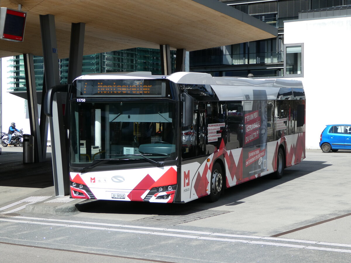 (247'622) - CarPostal Ouest - JU 36'548/PID 11'750 - Solaris am 25. Mrz 2023 beim Bahnhof Delmont