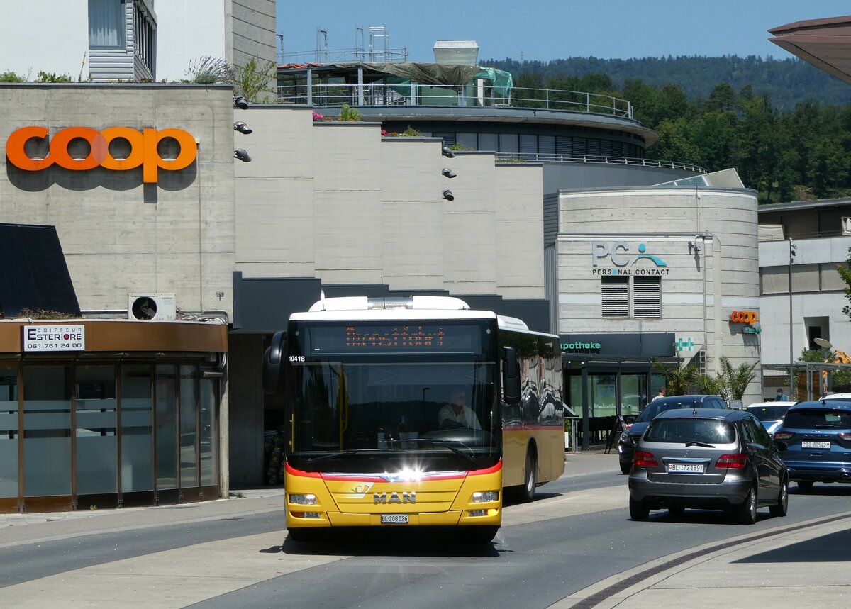 (252'433) - PostAuto Nordschweiz - BL 208'026/PID 10'418 - MAN am 7. Juli 2023 beim Bahnhof Laufen