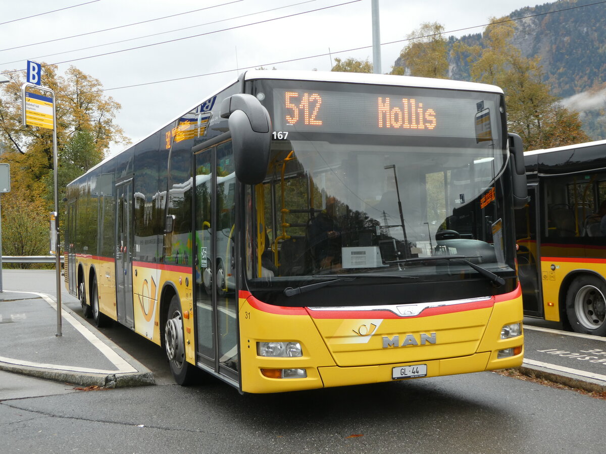 (256'564) - Niederer, Filzbach - Nr. 31/GL 44/PID 10'167 - MAN (ex Schwizer, Goldach; ex Casutt, Gossau) am 31. Oktober 2023 beim Bahnhof Ziegelbrcke