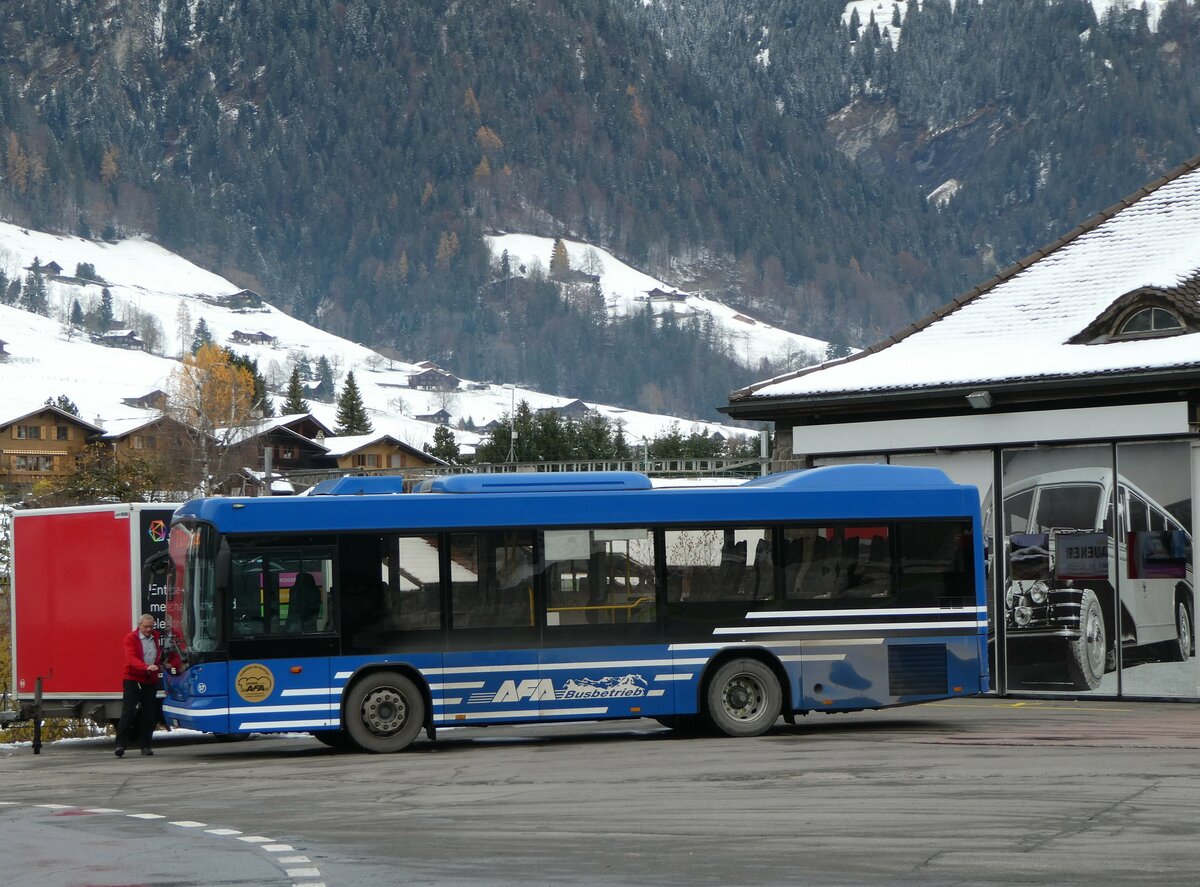 (257'265) - AFA Adelboden - Nr. 57/BE 272'798 - Scania/Hess am 27. November 2023 beim Bahnhof Frutigen