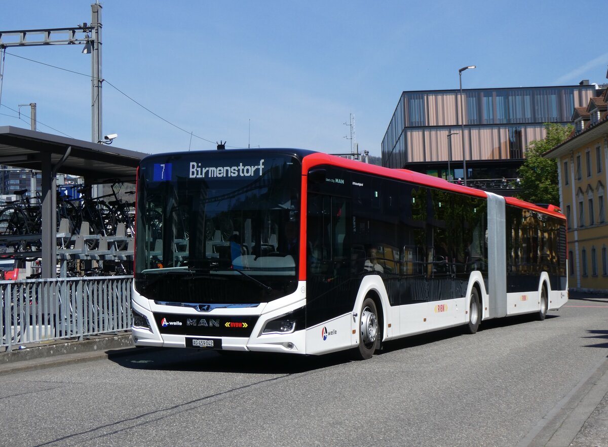 (261'167) - Twerenbold, Baden - Nr. 302/AG 549'042 - MAN am 12. April 2024 beim Bahnhof Baden