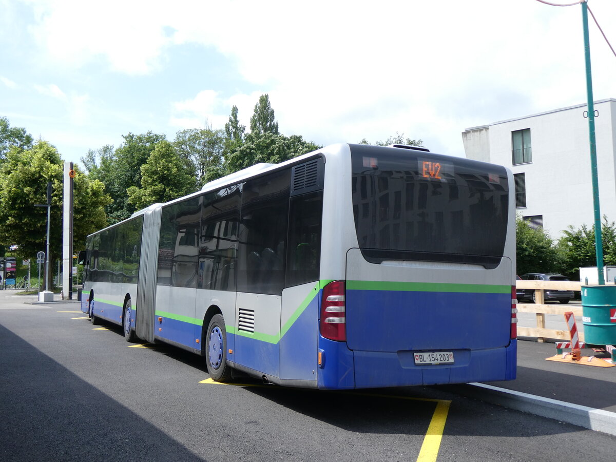 (276'221) - PostAuto Nordschweiz - BL 154'203/PID 12'421 - Mercedes (ex TPL Lugano Nr. 405) am 3. Juni 2025 beim Bahnhof Aesch