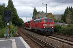 218 329-1 mit dem RE (RE 21449)  Hamburger Strand-Express  von Puttgarden und der RB (RB 21489)  Holsteinische-Schweiz-Express  von Kiel nach Hamburg Hbf am S-Bahn Haltepunkt Hamburg Landwehr und am