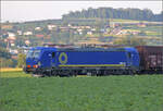 Blauer Vectron 7193 805 von Beacon bei Henschiken, Juni 2025.