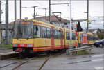 Die Strassenbahn  Be 4/8 003  alias 94 800 450 003-9 D-TVYS wartet in Chavornay auf die Fahrgäste der S-Bahnen.