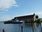 (254'507) - Motorschiff Rheiderland Karnin am Peenestrom am 31. August in Karnin