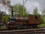 Vapeur Val-de-Travers: Train  Au fil de l'Areuse .

In Mtiers kommt E 3/3 8511 bereits entgegen, so bleibt nur ein Bild im Bahnhof. Mai 2023.