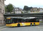 (255'866) - Dnser, Trimmis - GR 106'166/PID 10'166 - MAN am 4. Oktober 2023 beim Bahnhof Spiez