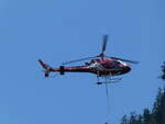 (252'086) - Air Zermatt - HB-ZCX - am 26. Juni 2023 ber dem Bahnhof Goppenstein