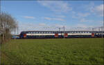 Re 450 102 mit Zug bei Jestetten.