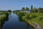 Am Rhein-Rhone-Kanal.

Z 27860 aus Mülhausen Richtung Belfort. Juli 2021.